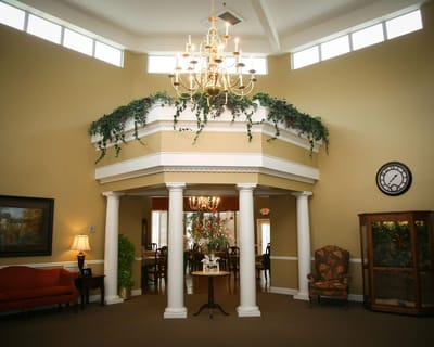 Interior view of a lobby area with chandelier