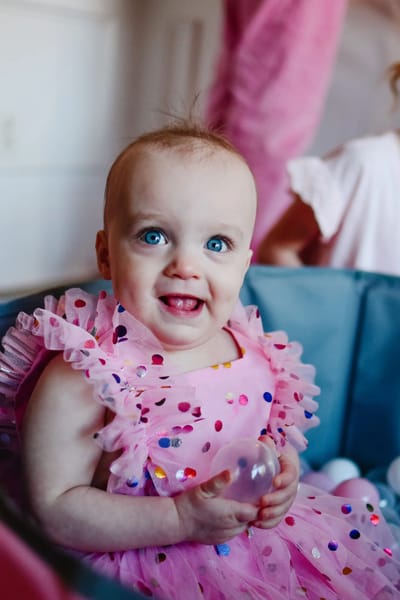Happy baby in a playful setting
