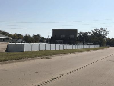Exterior view of the facility and surrounding fence