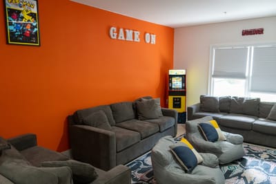 Interior lounge area with game machines and seating
