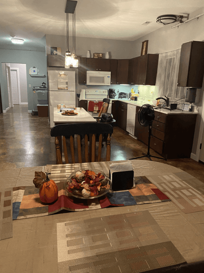 Kitchen area with a table set for a meal