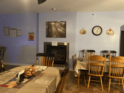 Interior dining area with tables and a fireplace