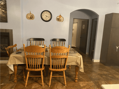 Dining area with wooden chairs and a table