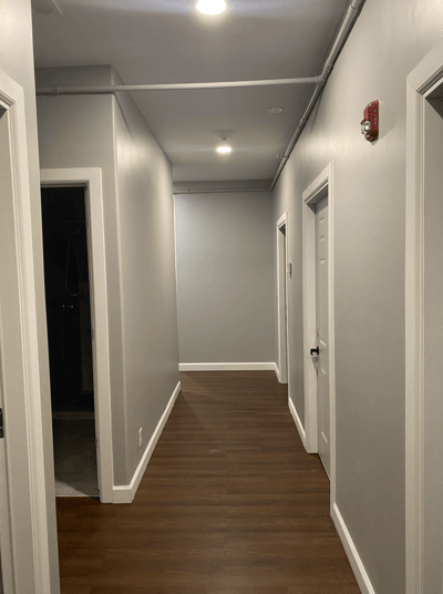 Empty hallway with doors on both sides