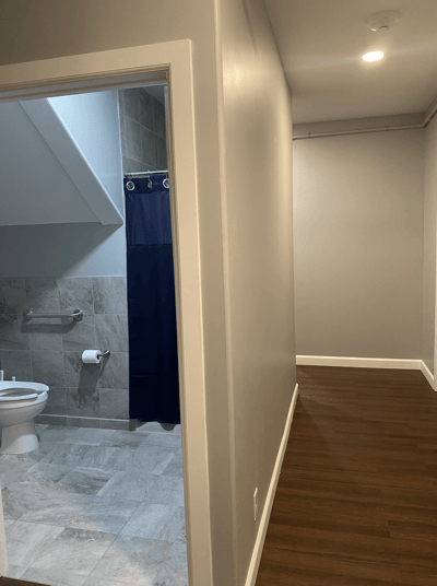 Interior hallway leading to a bathroom