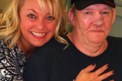 Carrollton Nursing & Rehab Ctr, Nursing Home in Carrollton, GA — Smiling woman embracing elderly man in care facility