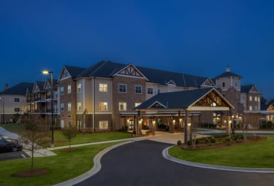 Exterior view of assisted living facility at dusk
