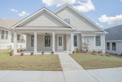 Exterior view of a senior living facility with landscaping