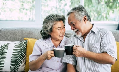 Couple enjoying coffee together in a cozy setting