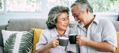 Seniors enjoying coffee together in a cozy space