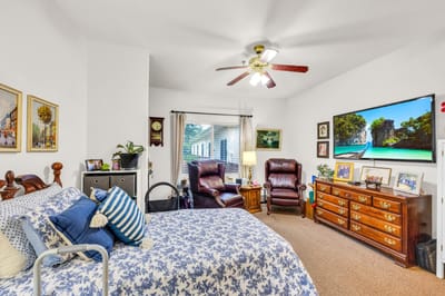 Cozy shared bedroom with armchairs and decorations