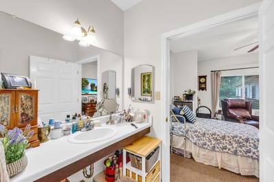A cozy resident room with a bed and personal items