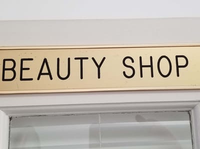 Sign for the beauty shop inside the facility