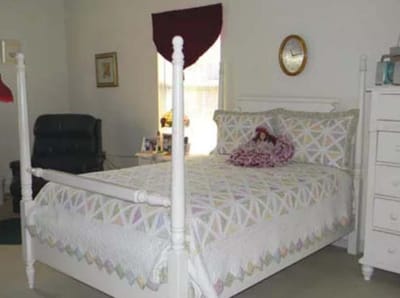 Cozy resident room with a decorated bed