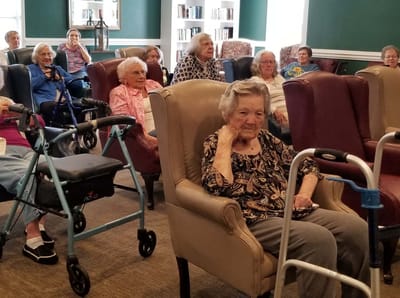 Residents participating in a group activity in the common area
