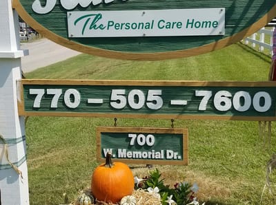Facility logo on a sign with contact information