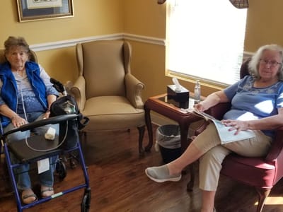 Two residents sitting in a common area