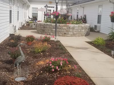 Beautifully landscaped outdoor space with flowers and seating areas