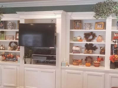 Interior view of a common area with decor and a TV