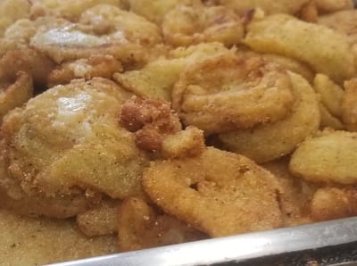 Tray of fried food items served in the dining area