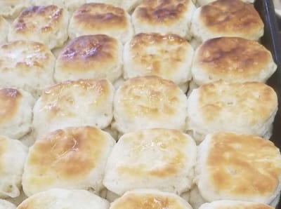 Freshly baked biscuits arranged in a tray
