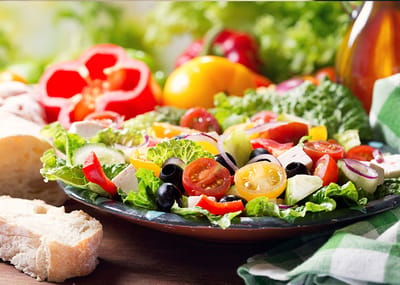 Colorful salad with fresh vegetables and bread