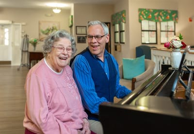 Residents enjoying a piano performance together