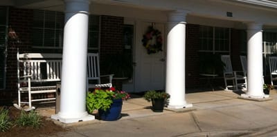 Entrance area of a senior living facility with rocking chairs