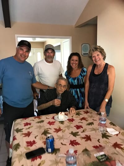 Residents and staff celebrating in a common area