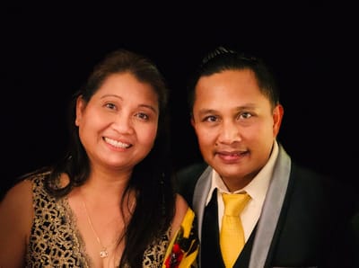 Two smiling people posing for a photo