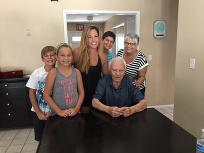 Residents and family members gathered around a table