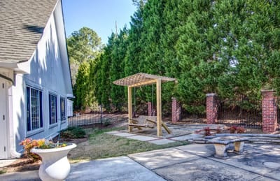 Outdoor space with a seating area and landscaping