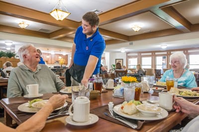 Residents enjoying a meal in the dining area