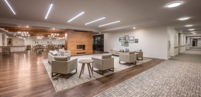 Bright common area with seating and dining space