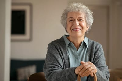 Smiling senior woman in a cozy interior setting