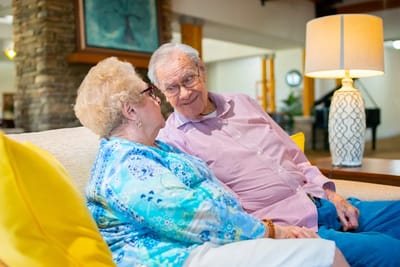 Residents enjoying a moment together in a cozy lounge