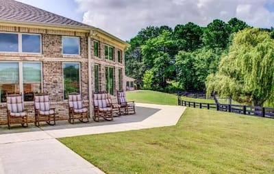 Outdoor seating area with rockers outside the facility