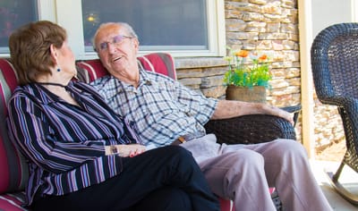 Residents engaging in conversation on a patio