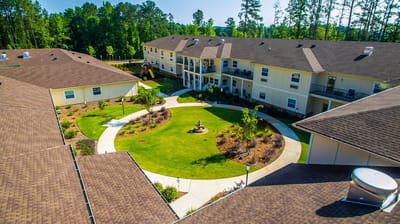 Aerial view of a landscaped courtyard in a senior living facility