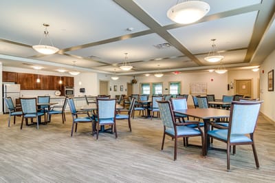 Bright dining area with tables and chairs