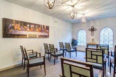 Interior room with seating and religious artwork