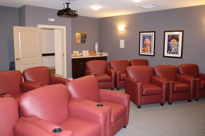 Cozy common area with red armchairs and decorative art