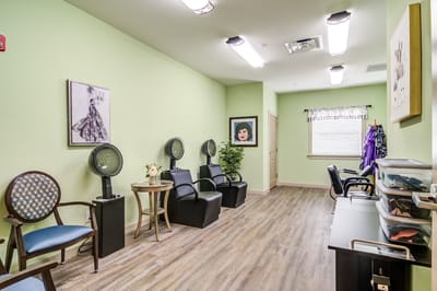 Interior view of a salon area with hairdryers