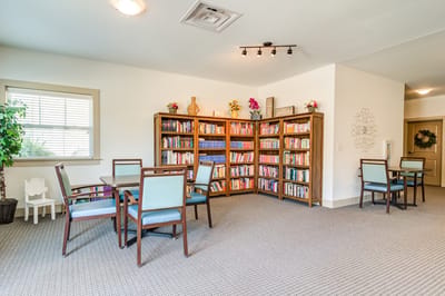 Bright common area with bookshelves and seating