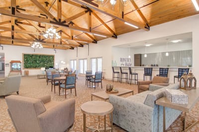 Bright common area with seating and bar