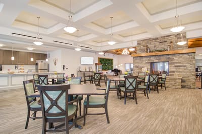 Bright dining room with tables arranged for residents