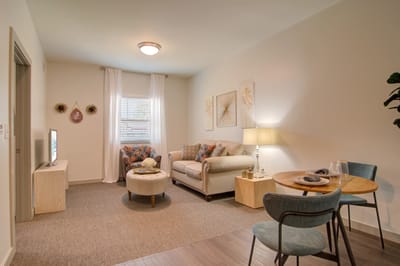 Cozy interior living space with seating area and dining table