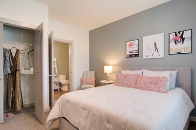 Cozy bedroom with decorative wall art in assisted living facility