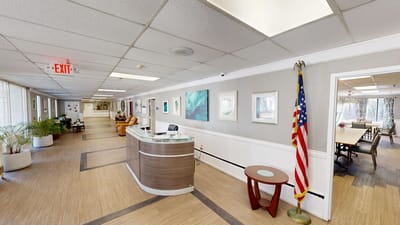 Interior view of a well-lit common area with reception