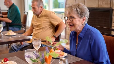 Residents enjoying dessert in the dining room